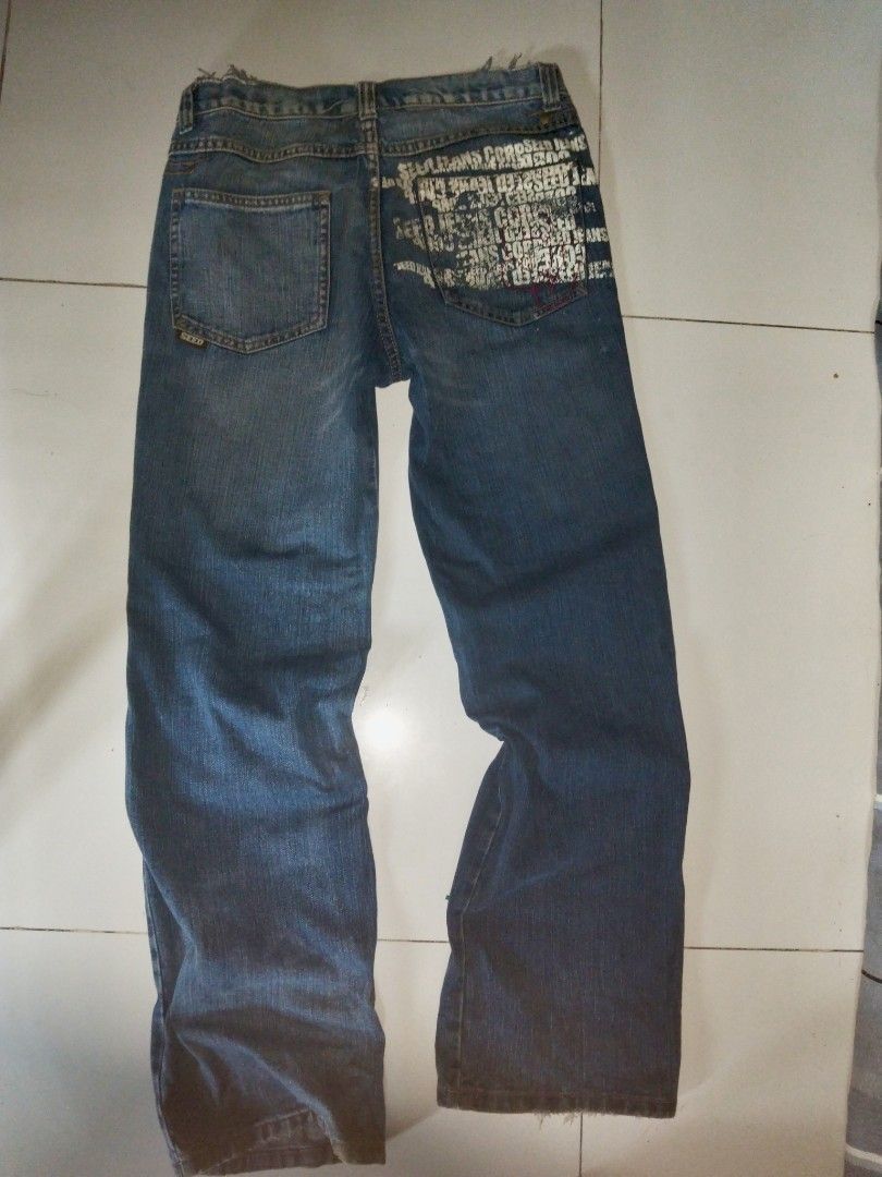 Seed Jeans Corp Straight Cut Denim Pants (Category: Jeans) located in Manila. Submitted by cxrlsobasedd_ (Listing ID 1465990049, Image 1). Description: - Brand: Seed Jeans Corp - Color: Classic blue wash - Fit: Straight leg, standard five-pocket style - Details: Graphic print on back pocket and unique distressed raw hem along the waistband - Vibe: Vintage streetwear aesthetic.