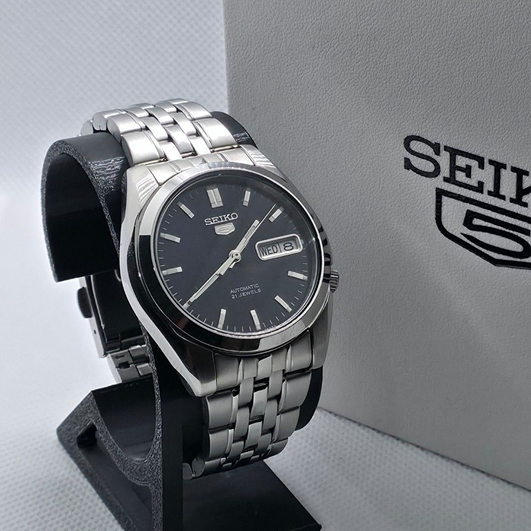 Seiko 5 "SNK357" (Category: Men's Watches) located in Cebu City. Submitted by morentimepiece (Listing ID 1465744808, Image 2). Description: WATCH DETAILS: • Model: Seiko SNK357 • Size: 38mm • Movement: Automatic • Display: Day and Date • Open Back • Seiko Replacement Box • Complete Links • Authentication Card WHAT'S INCLUDED: ✅ Newly Serviced ✅ Newly Polished ✅ 14-Day Machine Warranty ✅ Money-Back Guarantee if proven fake ✅ Price is negotiable fo
