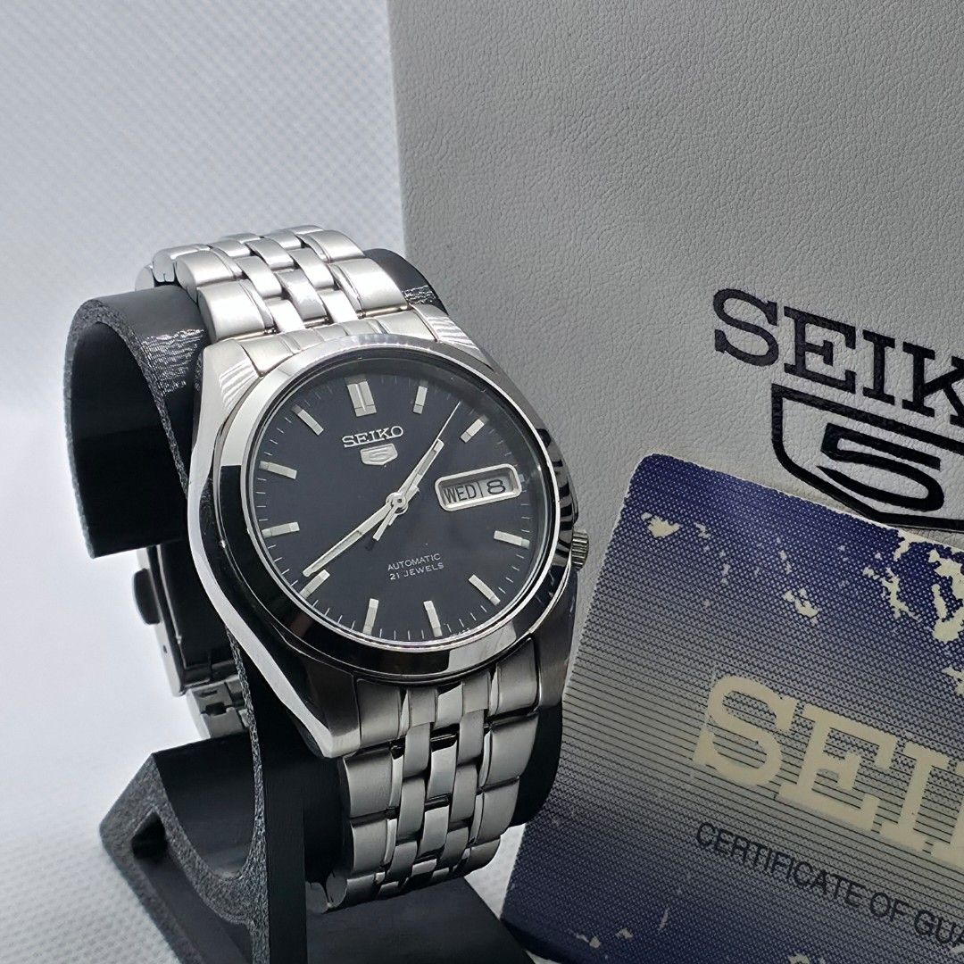Seiko 5 "SNK357" (Category: Men's Watches) located in Cebu City. Submitted by morentimepiece (Listing ID 1465744808, Image 3). Description: WATCH DETAILS: • Model: Seiko SNK357 • Size: 38mm • Movement: Automatic • Display: Day and Date • Open Back • Seiko Replacement Box • Complete Links • Authentication Card WHAT'S INCLUDED: ✅ Newly Serviced ✅ Newly Polished ✅ 14-Day Machine Warranty ✅ Money-Back Guarantee if proven fake ✅ Price is negotiable fo