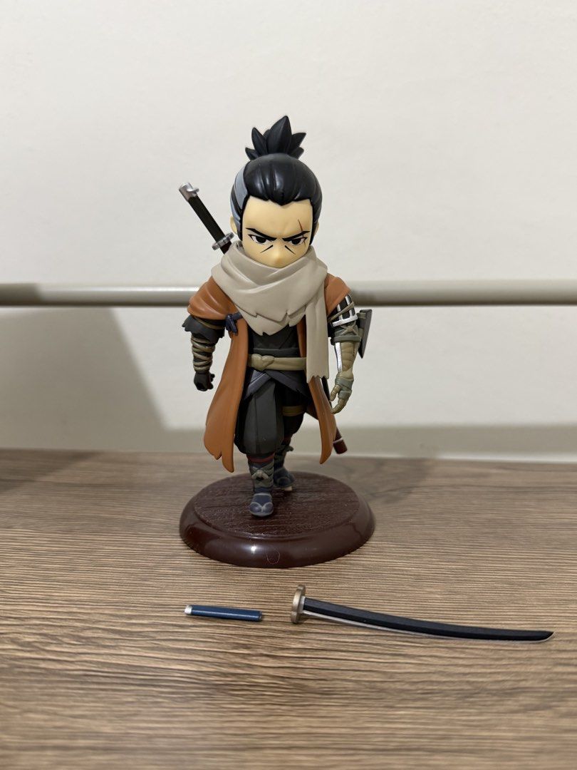 Sekiro Shadows Die Twice Figure (BIB) (Category: Figurines & Statues) located in Magalang. Submitted by xeevain (Listing ID 1466049806, Image 3). Description: - Brand: AcToys (Sekiro Shadows Die Twice Series) - Condition: BIB (Back in Box) / Pre-owned - Details: Chibi-style pre-painted figure mounted on a sturdy brown base - Flaw Note: One sword accessory is detached/broken (please check photos) - Packaging: Comes with original plastic blister an