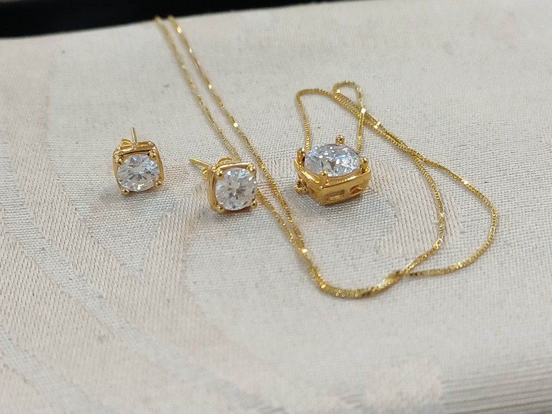 Set earring and ring (Category: Earrings) located in Makati City. Submitted by divinejewels.ph (Listing ID 1466040038, Image 2). Description: GFM-747 SET EARRING,NECKLACE PENDANT WHITE STONE 18KYG 1.7GRAMS 18' 7.7 6.7MM.