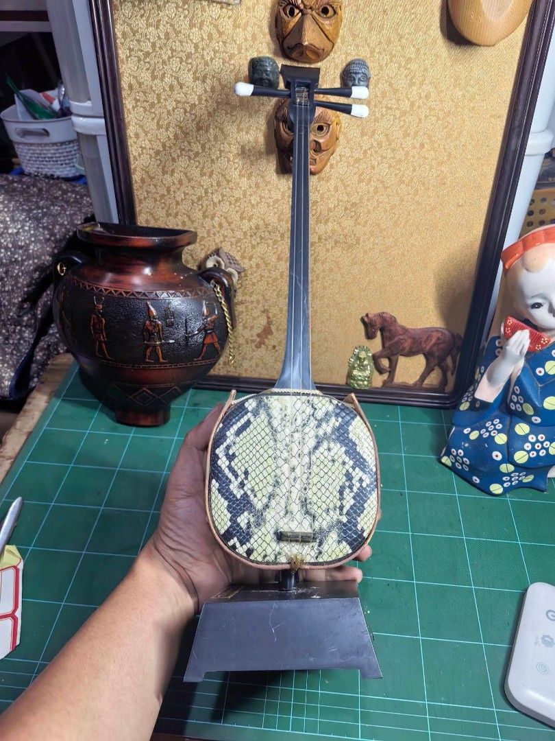 Shamisen Figure Display (Category: Other Home Decor) located in Cebu City. Submitted by dudes_villanueva (Listing ID 1466110638, Image 1). Description: Shamisen Figure Display Plastic Body and Base. 📌 Music Gear not working. Pang display nalang. Height: 17.5 in.