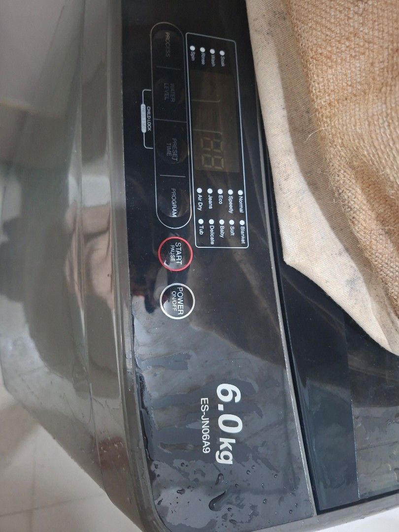 Sharp 6.0kg Top Load Washing Machine ES-JN06A9 (Category: Washing Machines and Dryers) located in Mandaluyong City. Submitted by vhiedns (Listing ID 1465982385, Image 2). Description: - Brand/Model: Sharp ES-JN06A9 - Capacity: 6.0kg (ideal for singles or small families) - Control Panel: Digital interface with multiple wash programs (Normal, Speedy, Eco, Jeans, Air Dry, Blanket, Soft, Baby, Delicate, Tub) - Features: Process indicators (Soak, Wash