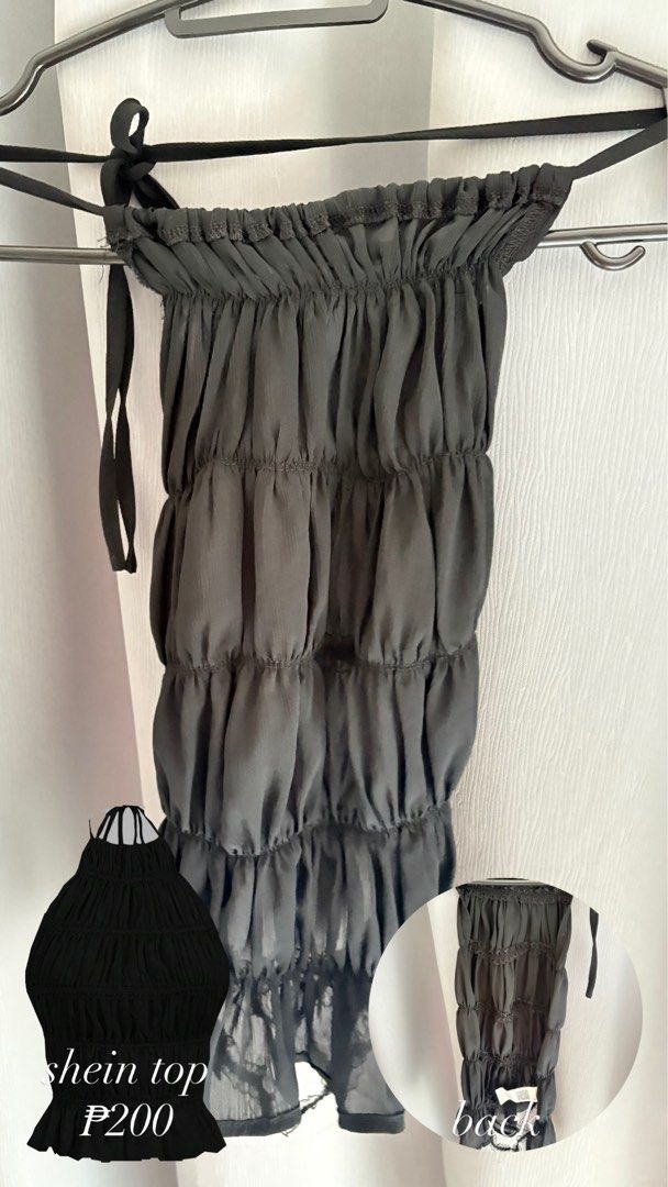 Shein Black Ruched Top (Category: Sleeveless) located in Makati City. Submitted by jrnhnnh3047116 (Listing ID 1466024249, Image 1). Description: - Brand: Shein - Color: Black - Style: Gathered tiered design with halter neck - Details: Lightweight and slightly sheer fabric with adjustable back-tie straps - Condition: Brand new with tag attached at the bottom hem.