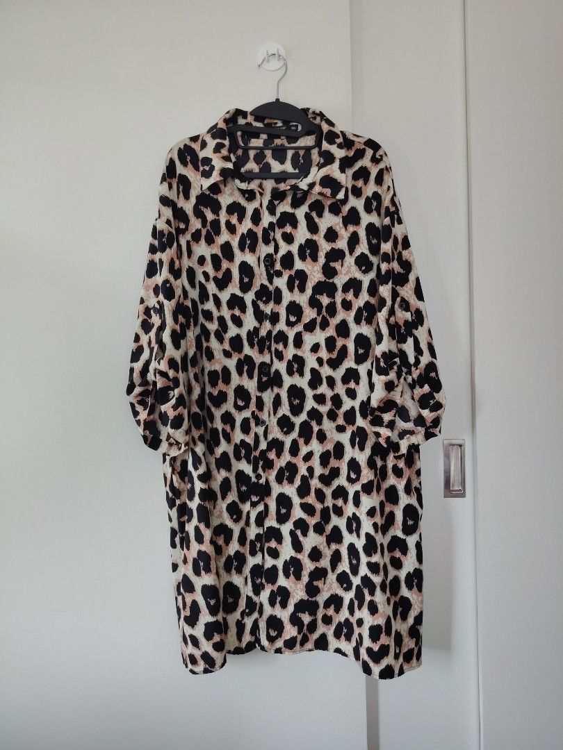 Shein Curve Leopard Print Button-Down Shirt Plus Size (Category: Blouses) located in Manila. Submitted by babeboxtheory (Listing ID 1466071597, Image 1). Description: - Brand: Shein Curve - Size: 3XL (Comfortable, roomy fit) - Design: Bold all-over leopard animal print with classic collar - Sleeves: Long sleeves with convenient tabs to roll them up - Fabric: Lightweight and breathable - Style: Perfect for effortless casual wear.