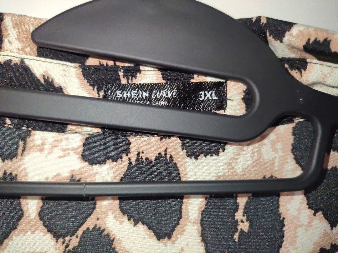 Shein Curve Leopard Print Button-Down Shirt Plus Size (Category: Blouses) located in Manila. Submitted by babeboxtheory (Listing ID 1466071597, Image 2). Description: - Brand: Shein Curve - Size: 3XL (Comfortable, roomy fit) - Design: Bold all-over leopard animal print with classic collar - Sleeves: Long sleeves with convenient tabs to roll them up - Fabric: Lightweight and breathable - Style: Perfect for effortless casual wear.