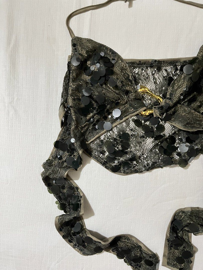 SHEIN Green Sequin Halter Crop Top Size S (Category: Sleeveless) located in Quezon City. Submitted by getitrightaway.ph (Listing ID 1466043773, Image 2). Description: - Brand: Shein - Size: S - Color/Style: Olive green halter crop top with shiny black sequins and lace overlay - Features: Open back, secure halter ties, and trendy gold hardware ring connector - Condition: Brand new, only tried on, tag still attached - Perfect for: Nights out, parti
