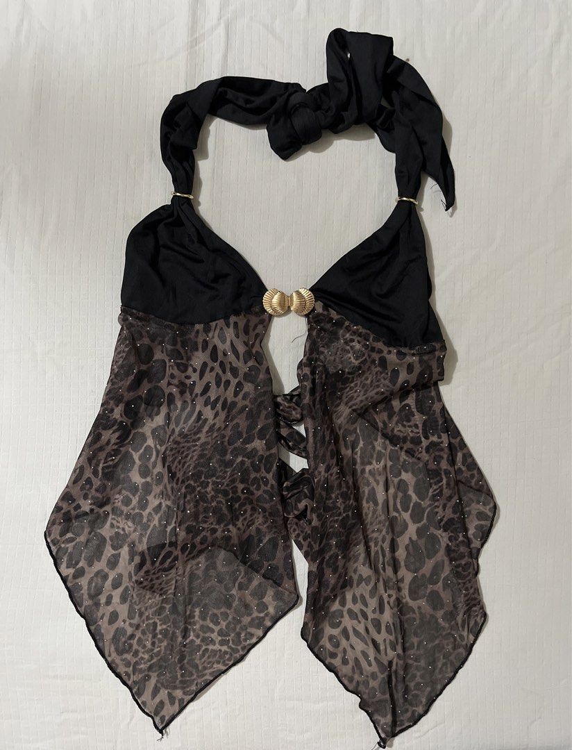 Shein Leopard Print Mesh Halter Top with Shell Buckle (Category: Sleeveless) located in Quezon City. Submitted by getitrightaway.ph (Listing ID 1466070251, Image 2). Description: - Brand: Shein - Design: Solid black upper with leopard print sheer mesh lower section - Details: Sparkly rhinestones scattered on mesh & gold-tone shell-shaped front buckle - Closure: Halter neck tie and adjustable back tie - Hemline: Asymmetrical handkerchief hem - Mat