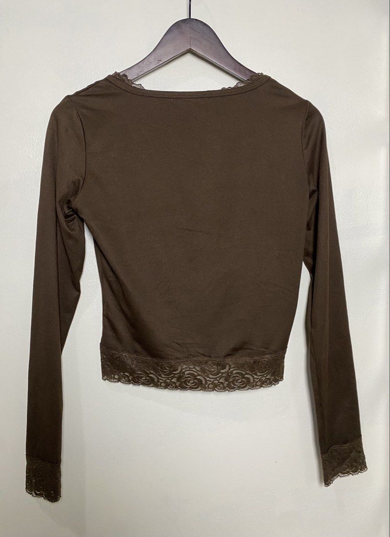 Shein long sleeve crop top (Category: Others Tops) located in Makati City. Submitted by indaysukaycloset (Listing ID 1466024656, Image 3). Description: SHEIN LACE TRIM LONG SLEEVE CROP TOP Brand: SHEIN Size: M on tag - Fits S-M Color: Choco Brown / Coffee Brown Details: - Style: Scoop neckline, long sleeve, cropped fit - Accent: Lace trim on neckline, hem, and cuffs - elegant - Material: 95% Polyester 5% Elastane - stretchy, soft, body-hugging - 