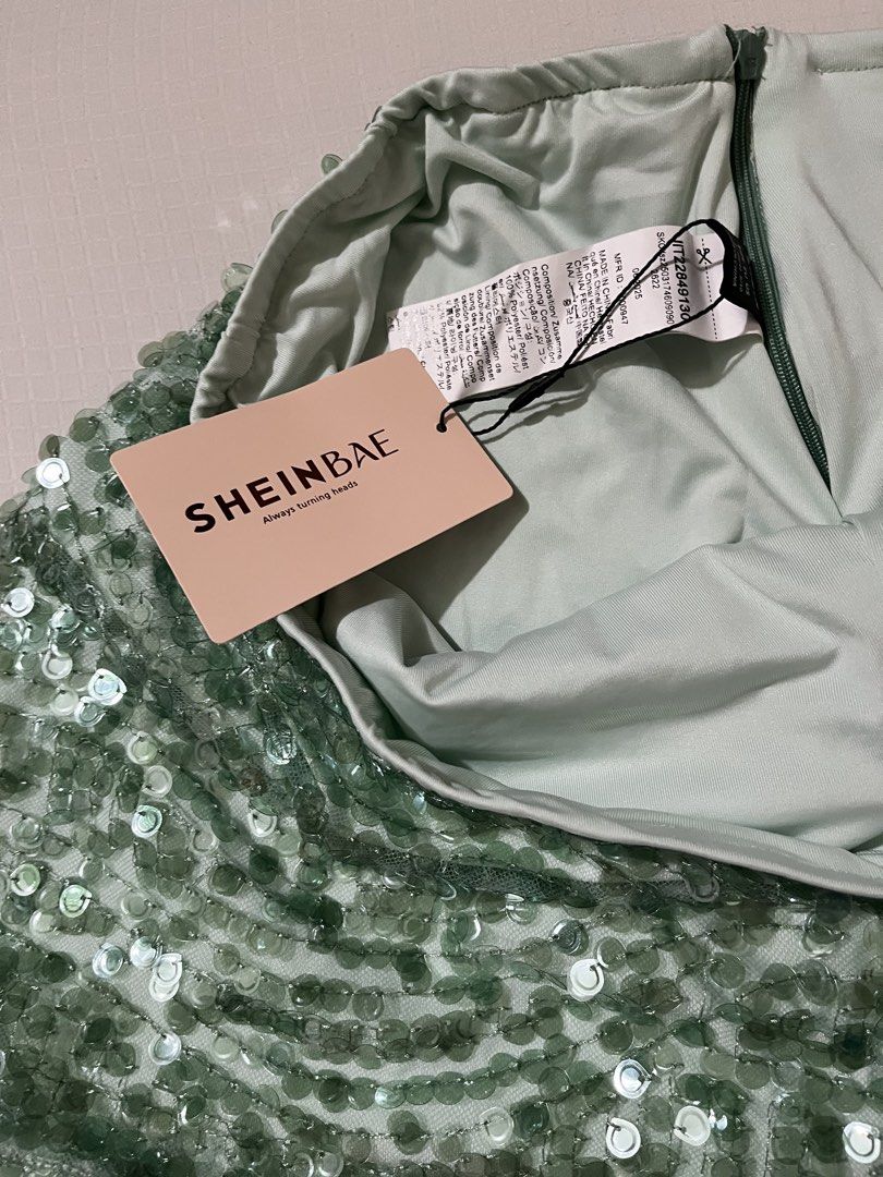 SHEINBAE Green Sequin Mini Skirt (Category: Skirts) located in Quezon City. Submitted by earthtodior (Listing ID 1466037226, Image 2). Description: - Condition: Brand new with tags (BNWT), never worn - Color/Design: Mint green with sparkling sequins and a chic mesh overlay - Closure: Secure back zipper - Material: 100% polyester - Occasion: Perfect for parties, clubs, and night outs.