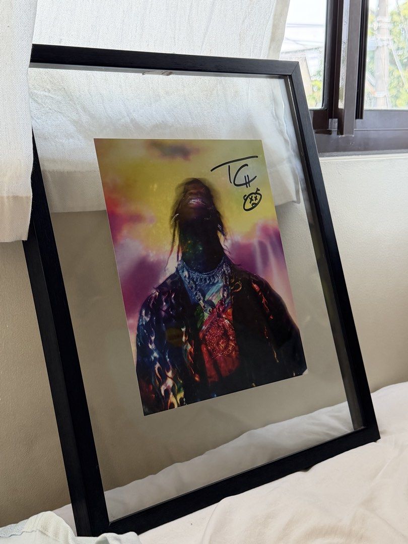 Signed Travis Scott Lithograph Framed (Category: Art & Prints) located in Muntinlupa City. Submitted by kawaiichulo123 (Listing ID 1465960320, Image 2). Description: - Framed Travis Scott art print - Signed at the top right corner with a marker signature and smiley doodle - Comes with a black frame included .