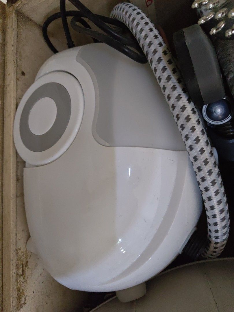 Simplus 2-in-1 Garment Steamer (Category: Irons & Steamers) located in Las Pinas. Submitted by Kariicature (Listing ID 1465965336, Image 3). Description: - Brand: Simplus - Type: Standing garment steamer with ironing board attachment - Color: White base unit - Controls: Rotary dial with specific fabric settings (Wool to Silk) and Humidify mode - Accessories: Flexible braided steam hose included - Condition: Excellent, highly useful for effortless