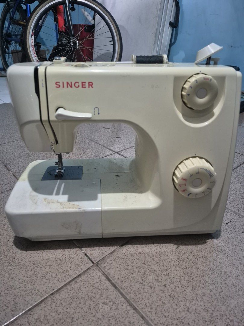 Singer Sewing Machine Model 8280 (Category: Art & Prints) located in Manila. Submitted by munggomooo (Listing ID 1466024648, Image 1). Description: - Brand/Model: Singer 8280 Sewing Machine - Power: 230-240V, 50Hz, 85W (Built-in light up to 15W) - Features: Multiple stitch selection dials and convenient reverse lever - Condition: Fully functional with some cosmetic scuffs and marks on the plastic casing from previous storage and usage.