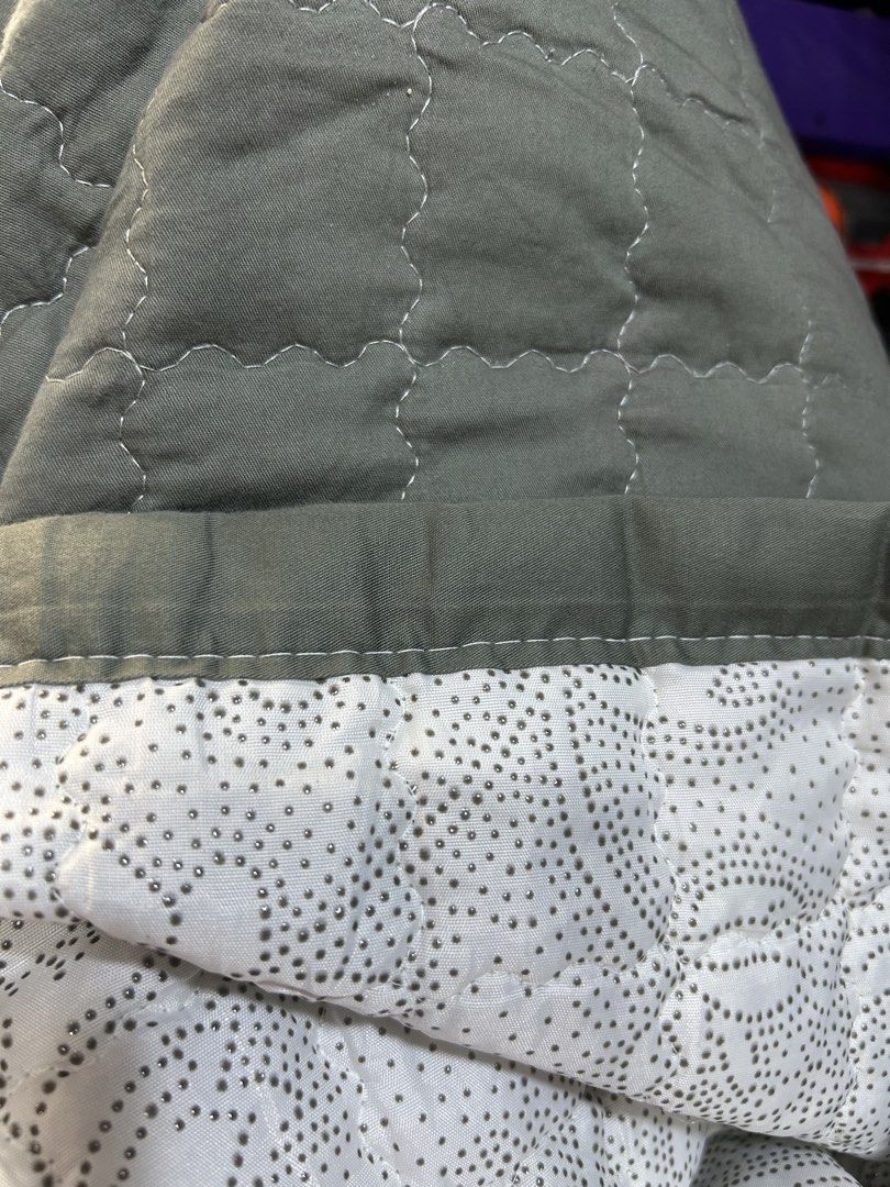 Single Quilted blanket sage green with polka dot backing bedpad (Category: Bedding & Towels) located in Manila. Submitted by starbalesukandjapansurplus (Listing ID 1465961326, Image 2). Description: - Color: Sage green front, white with tiny grey polka dots on the reverse - Design: Full coverage square stitching pattern with a soft textured border hem - Material/Feel: Lightweight, cozy, and soft to the touch - Versatility: Perfect as an extra lay