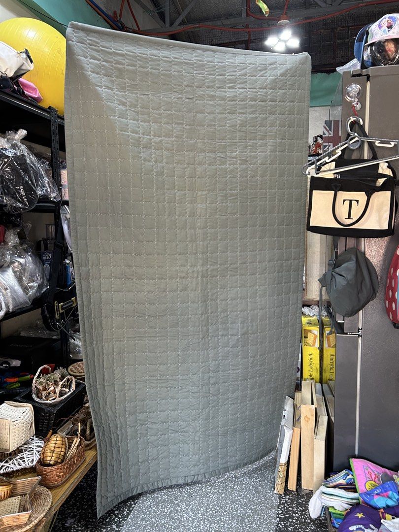 Single Quilted blanket sage green with polka dot backing bedpad (Category: Bedding & Towels) located in Manila. Submitted by starbalesukandjapansurplus (Listing ID 1465961326, Image 1). Description: - Color: Sage green front, white with tiny grey polka dots on the reverse - Design: Full coverage square stitching pattern with a soft textured border hem - Material/Feel: Lightweight, cozy, and soft to the touch - Versatility: Perfect as an extra lay