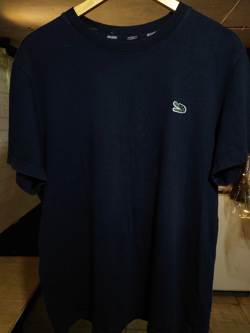 Skechers tshirt thrift (Category: Tshirts & Polo Shirts ) located in Paranaque City. Submitted by emzeicool48572 (Listing ID 1466057990, Image 1). Description: Size: Large to Semi- XL (22.5x28 inch) Material: Cotton Semi- heavy Cotton Color: Black color rate: 9/10 Condition: 9/10 📍Tambo Paranaque 💸Payment: Pay Maya only 📦🚚 Delivery: Lalamove or j&t (order mo book mo) No return policy Buy at your own risk Don't expect too much from this produc