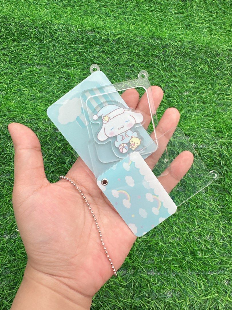 Sleeping Cinnamoroll Sanrio Acrylic Keychain (Category: Character Goods) located in Manila. Submitted by ronoarabbit.ph (Listing ID 1466047851, Image 2). Description: - Character: Sleeping Cinnamoroll (Sanrio) - Design: Cute layered acrylic keychain featuring blue clouds, rainbow, and a small companion - Material: High-quality transparent acrylic with metal ball chain - Condition: Brand new and ready to ship - Perfect accessory for backpacks, pur