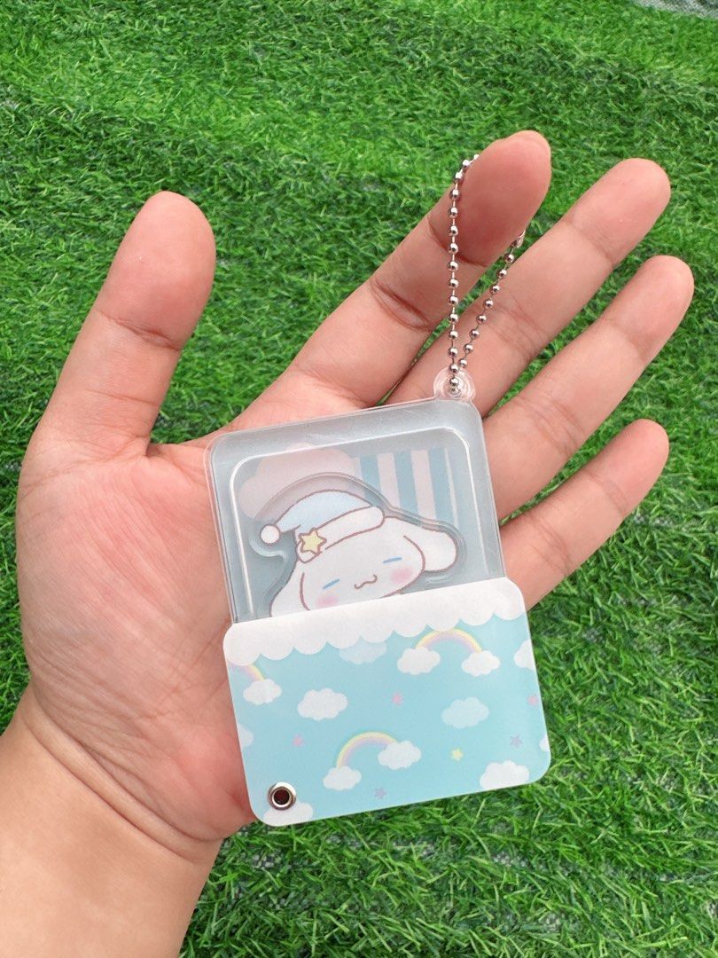 Sleeping Cinnamoroll Sanrio Acrylic Keychain (Category: Character Goods) located in Manila. Submitted by ronoarabbit.ph (Listing ID 1466047851, Image 1). Description: - Character: Sleeping Cinnamoroll (Sanrio) - Design: Cute layered acrylic keychain featuring blue clouds, rainbow, and a small companion - Material: High-quality transparent acrylic with metal ball chain - Condition: Brand new and ready to ship - Perfect accessory for backpacks, pur
