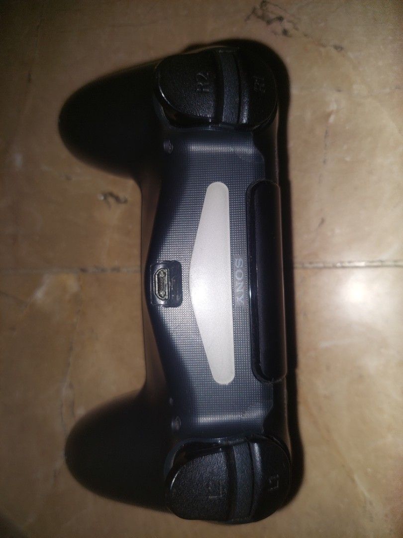 Sony PlayStation 4 DualShock 4 Wireless Controller (Category: Controllers) located in Pasig City. Submitted by ybarralucas05 (Listing ID 1466031186, Image 3). Description: - Color: Classic Black - Compatibility: Works seamlessly with all PS4 consoles - Comfort: Features textured grips on the handles for better control during long gaming sessions - Layout: Standard design with dual analog sticks, directional pad, and tactile action buttons - Conne