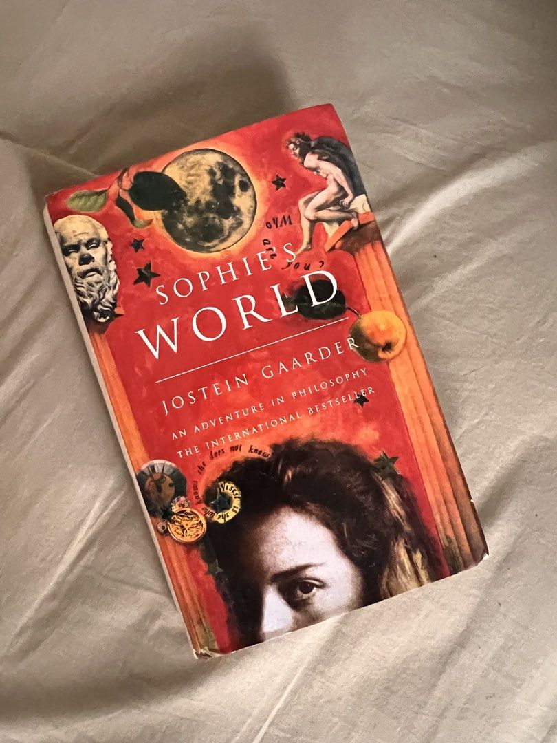 Sophie's World by Jostein Gaarder (Category: Storybooks) located in Dasmarinas. Submitted by mikay13ord86976 (Listing ID 1466034600, Image 1). Description: - Title: Sophie's World by Jostein Gaarder - Format: Paperback - ISBN: 1-897580-42-8 - Genre: Philosophy made easy through an engaging story - Condition: Shows cover wear around edges/spine and page yellowing from age and storage - Usability: Fully intact and still a very readable copy.