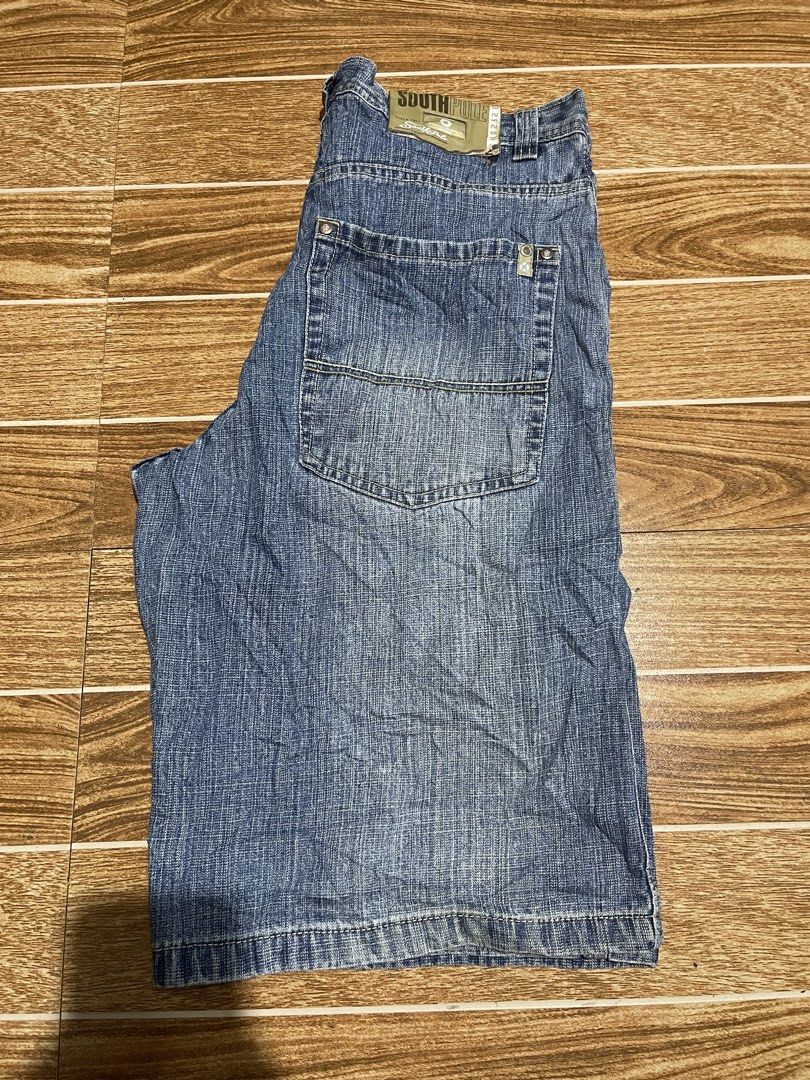 Southpole Denim Shorts Size 34 (Category: Shorts) located in Mandaluyong City. Submitted by mark2pac (Listing ID 1465953876, Image 1). Description: - Brand: Southpole - Size: 34 - Color: Blue wash - Fit: Classic baggy fit with wide leg opening - Details: Traditional 5-pocket setup, back pocket detailing, and branded patch on waistband - Construction: Heavy-duty stitching - Origin: Made in Pakistan - Style: Y2K streetwear vibe.