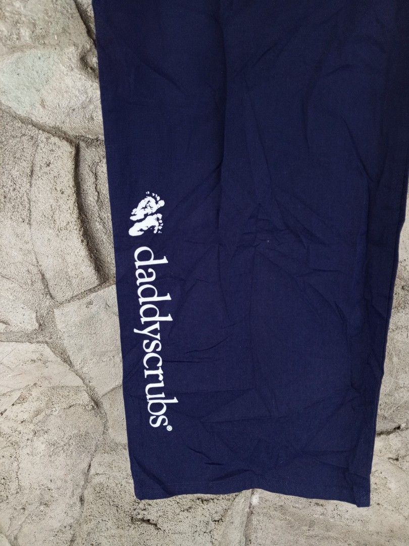 Spectrum Daddyscrubs Navy Blue Scrub Pants Size L (Category: Activewear) located in Orani. Submitted by thriftniea (Listing ID 1466043701, Image 2). Description: SIZE 42-46 - Brand: Spectrum (Style 306C) - Size: L - Color: Navy Blue - Material: 65% Polyester, 35% Cotton - Condition: Brand new with original hang tag attached - Special Feature: Daddyscrubs branding printed down the right lower leg.