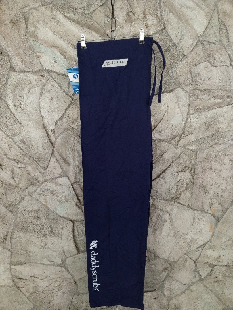 Spectrum Daddyscrubs Navy Blue Scrub Pants Size L (Category: Activewear) located in Orani. Submitted by thriftniea (Listing ID 1466043701, Image 1). Description: SIZE 42-46 - Brand: Spectrum (Style 306C) - Size: L - Color: Navy Blue - Material: 65% Polyester, 35% Cotton - Condition: Brand new with original hang tag attached - Special Feature: Daddyscrubs branding printed down the right lower leg.