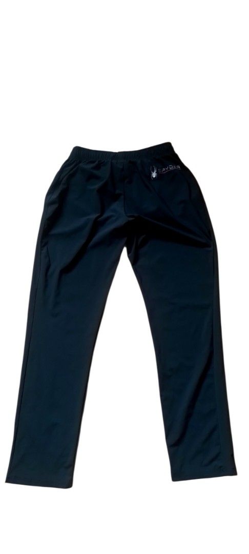 Spyder Black Track Pants XXL (Category: Joggers) located in Cagayan de Oro. Submitted by jublamerba95478 (Listing ID 1466010448, Image 3). Description: - Brand: Spyder - Color: Black - Size: XXL - Elastic waistband with secure drawstring - Zippered side pockets for safe storage - Signature spider logo near hip and back - Clean fabric, ideal for workouts or lounging.