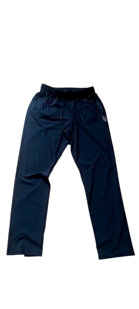 Spyder Black Track Pants XXL (Category: Joggers) located in Cagayan de Oro. Submitted by jublamerba95478 (Listing ID 1466010448, Image 2). Description: - Brand: Spyder - Color: Black - Size: XXL - Elastic waistband with secure drawstring - Zippered side pockets for safe storage - Signature spider logo near hip and back - Clean fabric, ideal for workouts or lounging.