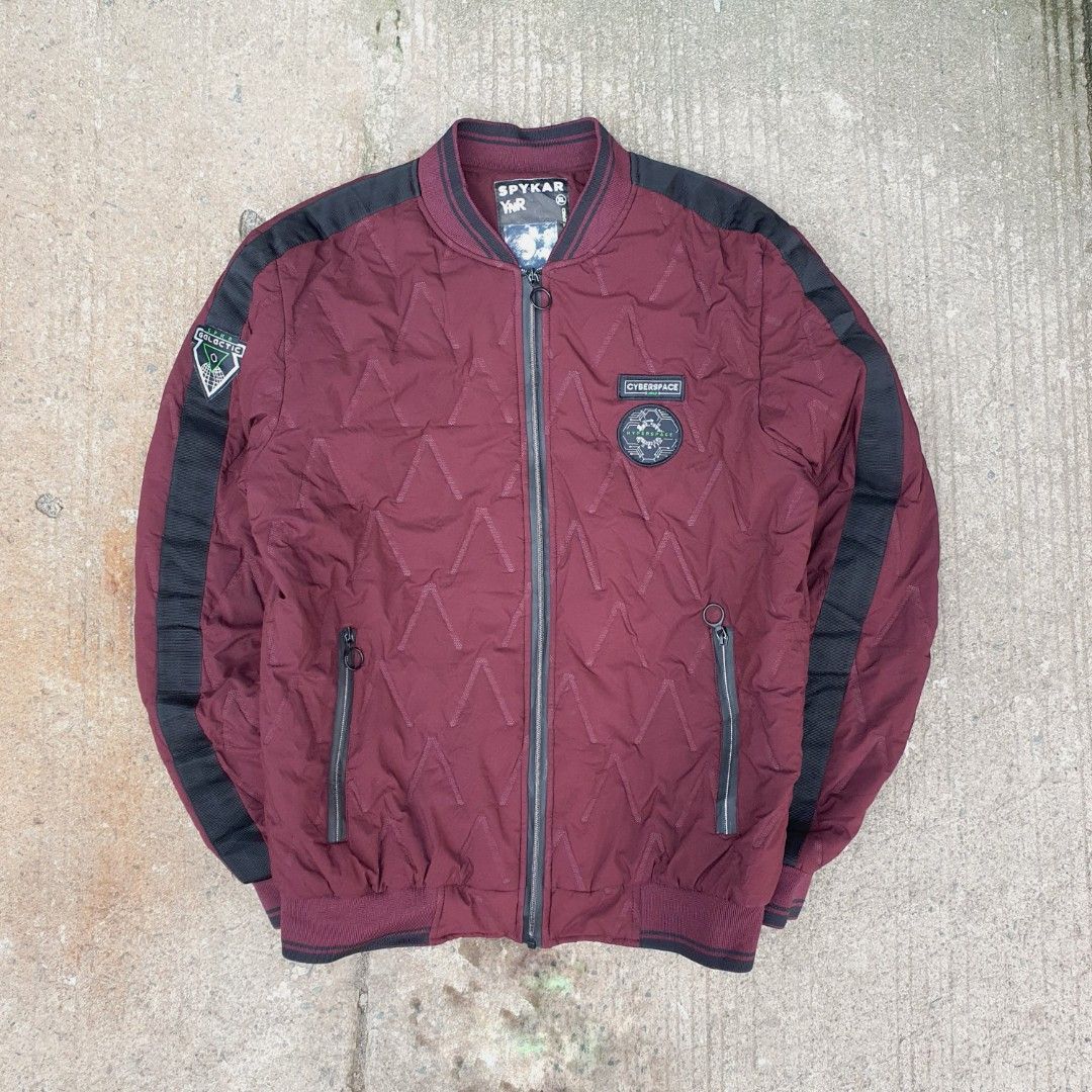Spykar Quilted Bomber Full Zip Jacket XL (Category: Coats, Jackets and Outerwear) located in Cavite. Submitted by josephnl (Listing ID 1466130927, Image 1). Description: Spykar quilted bomber jacket in maroon with black contrast sleeve panels. Full zip front closure with ring pulls, dual zip pockets, and ribbed collar and cuffs. Cyberspace and galactic patches on chest and right sleeve. 100% polyester, made in India. Size XL. Flat measurements: w