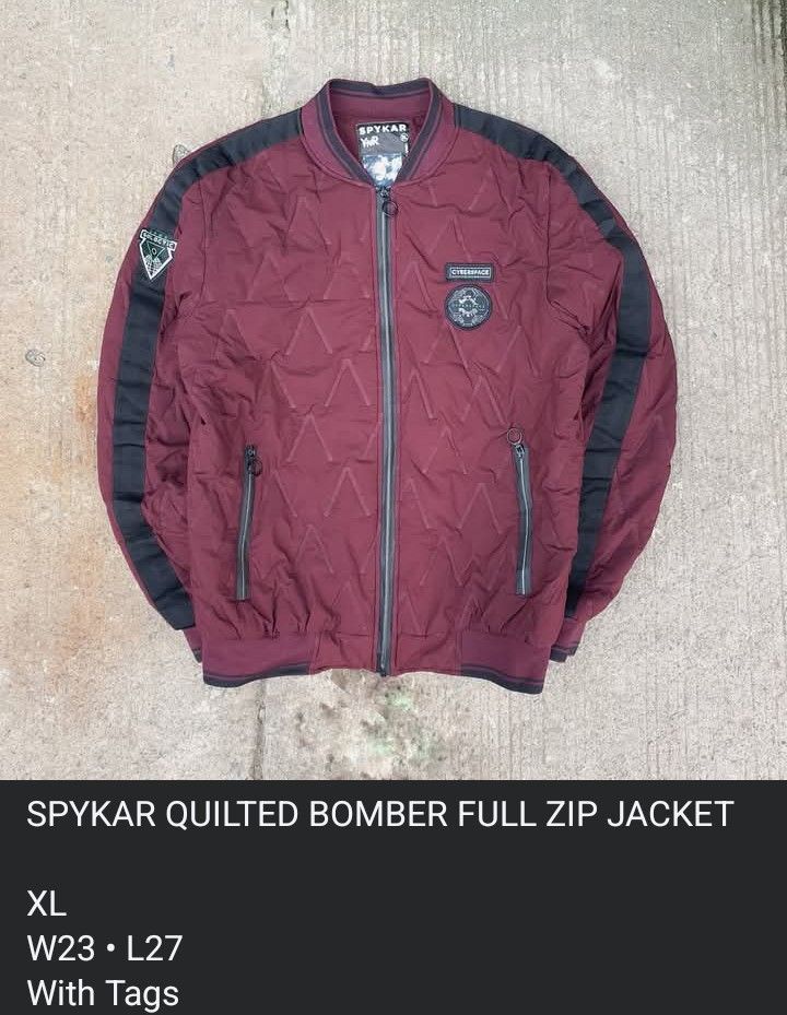 Spykar Quilted Bomber Full Zip Jacket XL (Category: Coats, Jackets and Outerwear) located in Cavite. Submitted by josephnl (Listing ID 1466130927, Image 3). Description: Spykar quilted bomber jacket in maroon with black contrast sleeve panels. Full zip front closure with ring pulls, dual zip pockets, and ribbed collar and cuffs. Cyberspace and galactic patches on chest and right sleeve. 100% polyester, made in India. Size XL. Flat measurements: w