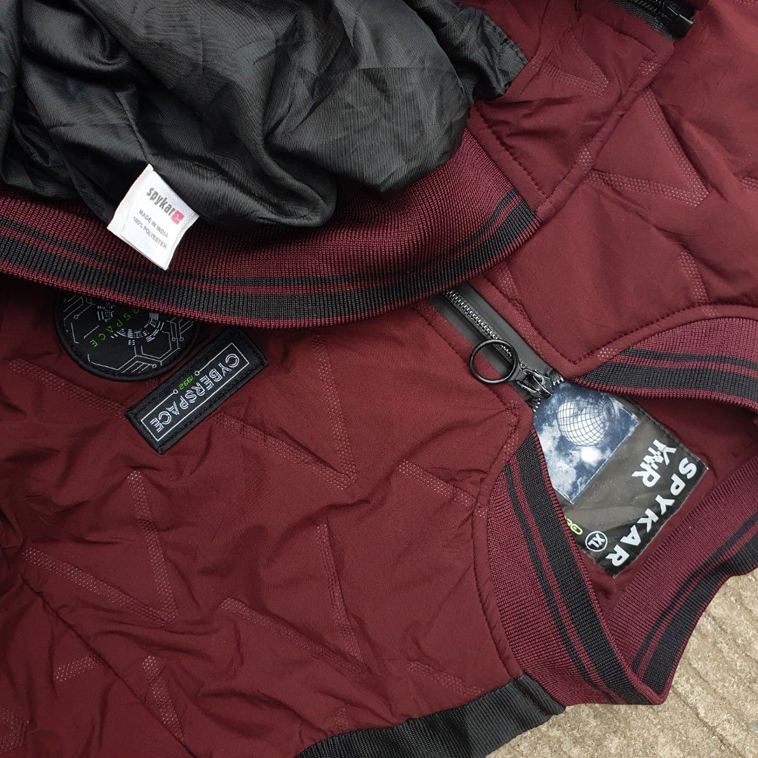 Spykar Quilted Bomber Full Zip Jacket XL (Category: Coats, Jackets and Outerwear) located in Cavite. Submitted by josephnl (Listing ID 1466130927, Image 2). Description: Spykar quilted bomber jacket in maroon with black contrast sleeve panels. Full zip front closure with ring pulls, dual zip pockets, and ribbed collar and cuffs. Cyberspace and galactic patches on chest and right sleeve. 100% polyester, made in India. Size XL. Flat measurements: w