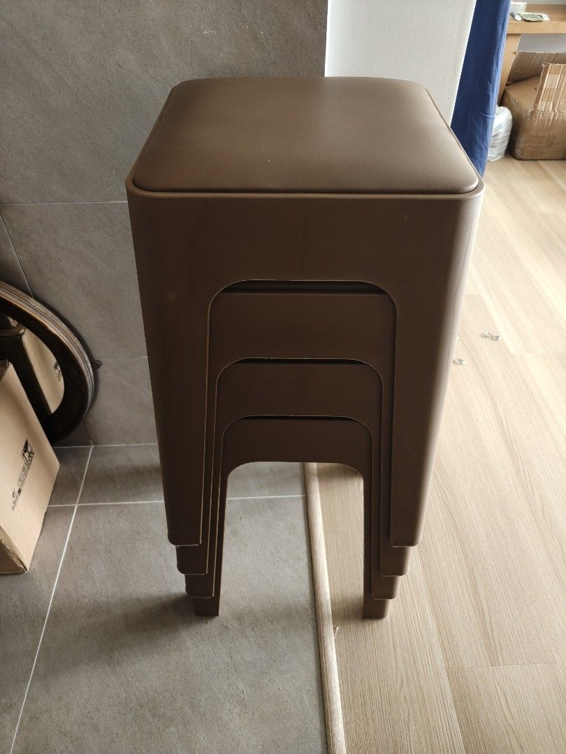 Stackable Brown Stools Set (Category: Chairs) located in Singapore. Submitted by lia.abdullah (Listing ID 1466048013, Image 1). Description: Set of (4) brown stackable stools • Comfortable cushioned top seats • Space-saving design that easily tucks away • Sturdy construction for daily use • Ideal for small apartments or extra seating • Clean condition overall. Had them for about 2 months. Rarely used. .