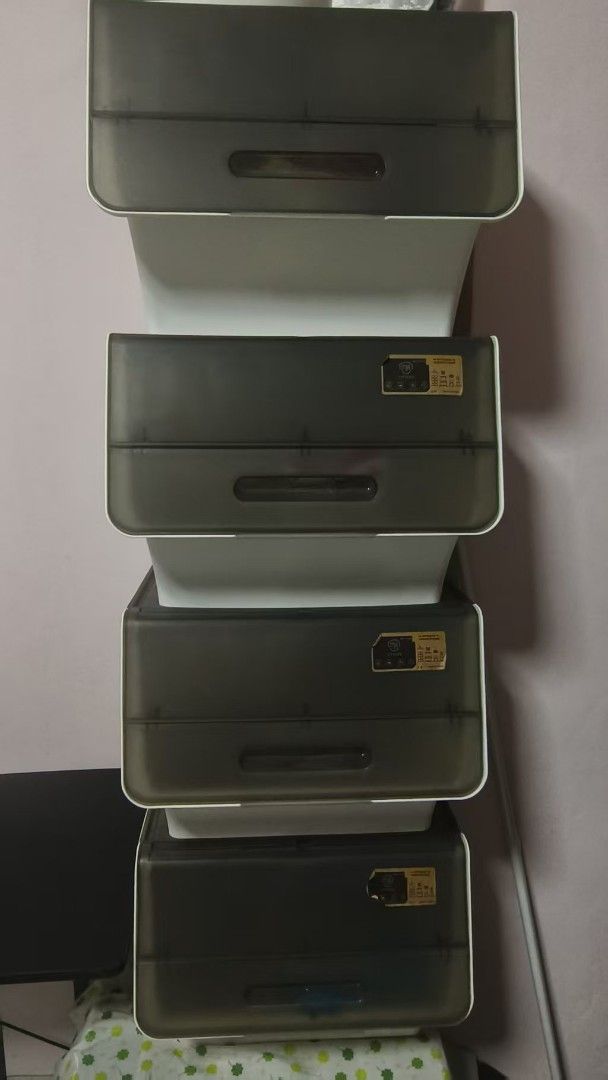 Stackable storage boxes (Category: Storage Boxes & Baskets) located in Singapore. Submitted by xixiner (Listing ID 1466030745, Image 1). Description: - Set of 4 stackable storage boxes - drop-front doors - Convenient pull handles on each door - Ideal for organizing clothes, snacks and household items Selling in set of 4 $30 Self pick up at telok blangah drive.