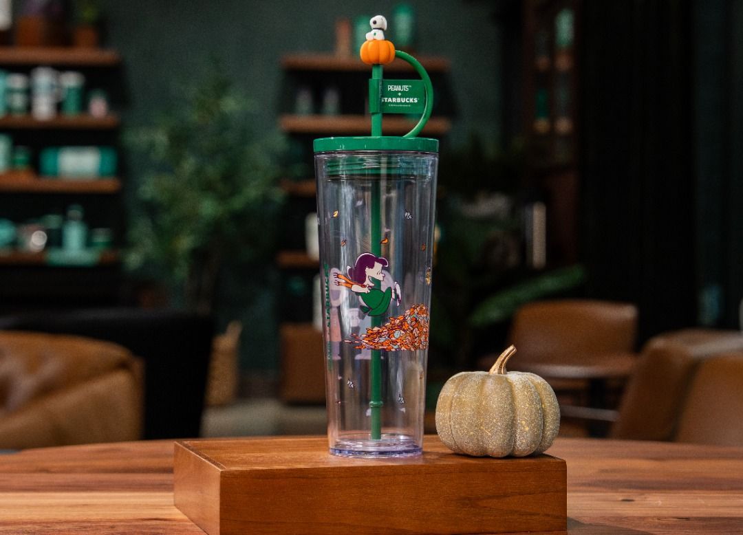 Starbucks x Peanuts Plastic CC Tumbler (Category: Water Bottles & Tumblers) located in Makati City. Submitted by savvy_girl (Listing ID 1466010206, Image 2). Description: - 100% Authentic Starbucks x Peanuts Collaboration - Design: Clear tumbler with wrap-around Charlie Brown and friends autumn graphic - Lid: Green lid featuring a convenient loop handle detail - Straw & Topper: Green straw complete with an adorable Snoopy sitting on an orange pum