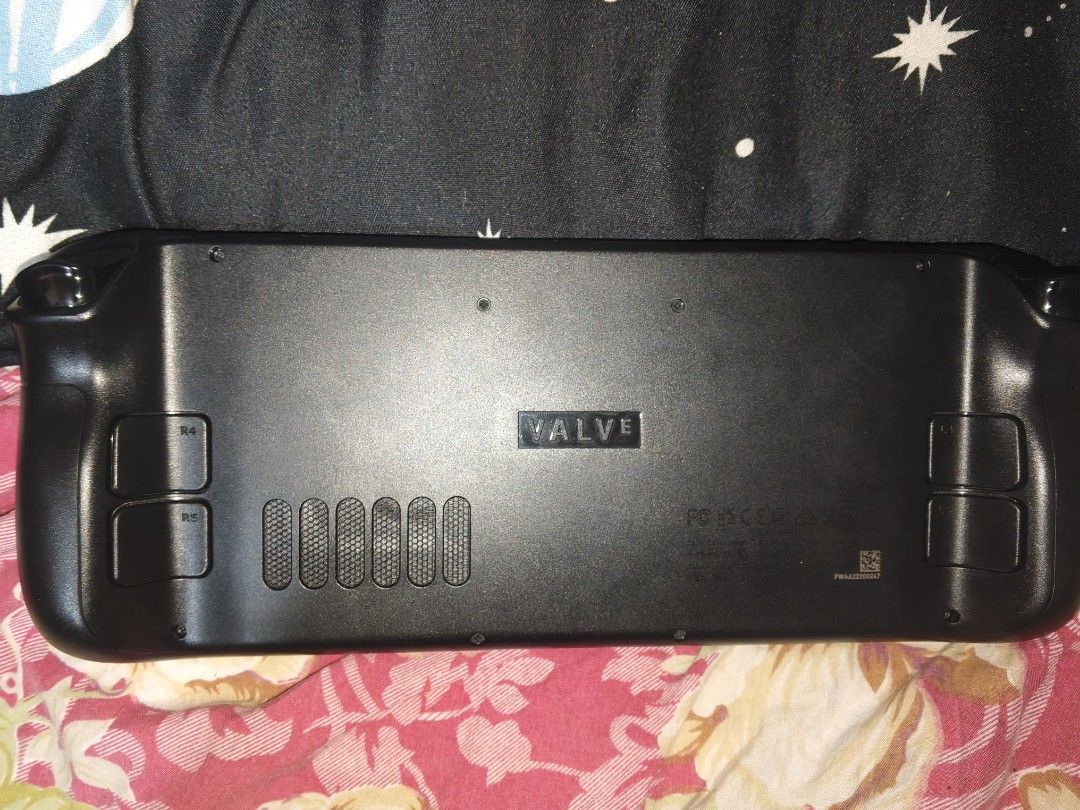 Steam Deck with Original Carrying Case (Category: Controllers) located in San Pedro. Submitted by kenken1678 (Listing ID 1465624228, Image 3). Description: Steam Deck LCD 256GB - Fully tested, powers on properly with Steam logo loading - Includes official black zippered carrying case with moulded interior compartments - Fully functional joysticks, trackpads, and ABXY buttonsS.