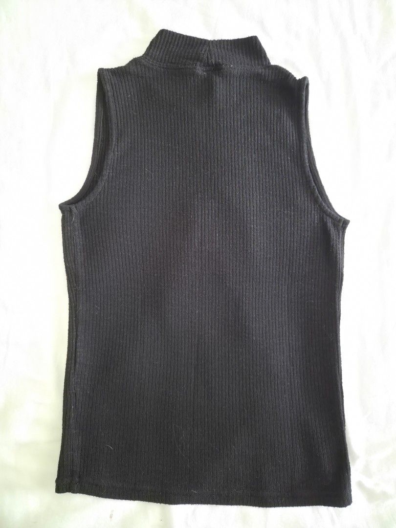 Stradivarius Black Ribbed Turtleneck Tank Top (Category: Sleeveless) located in Quezon City. Submitted by corrnic (Listing ID 1466031275, Image 3). Description: - Brand: Stradivarius - Size: EUR M / USA M / MEX 28 - Color: Classic Black - Material: Comfortable ribbed knit fabric - Fit: Fitted silhouette, great for layering or solo wear - Style: Minimalist and easy to match with high-waist jeans or skirts - Condition: Clean, excellent pre-loved co