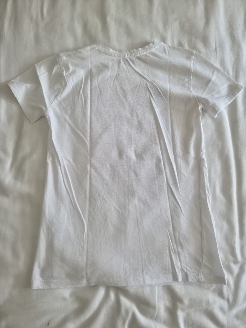 Stradivarius Open Mind Graphic White T-shirt (Category: Shirts) located in Quezon City. Submitted by corrnic (Listing ID 1466030453, Image 3). Description: - Brand: Stradivarius - Size: XS - Color: Clean White - Design: Colorful abstract graphic with 'OPEN MIND' text and quote - Details: Short sleeves, round neckline - Origin: Made in Egypt - Condition: Great for simple casual wear.
