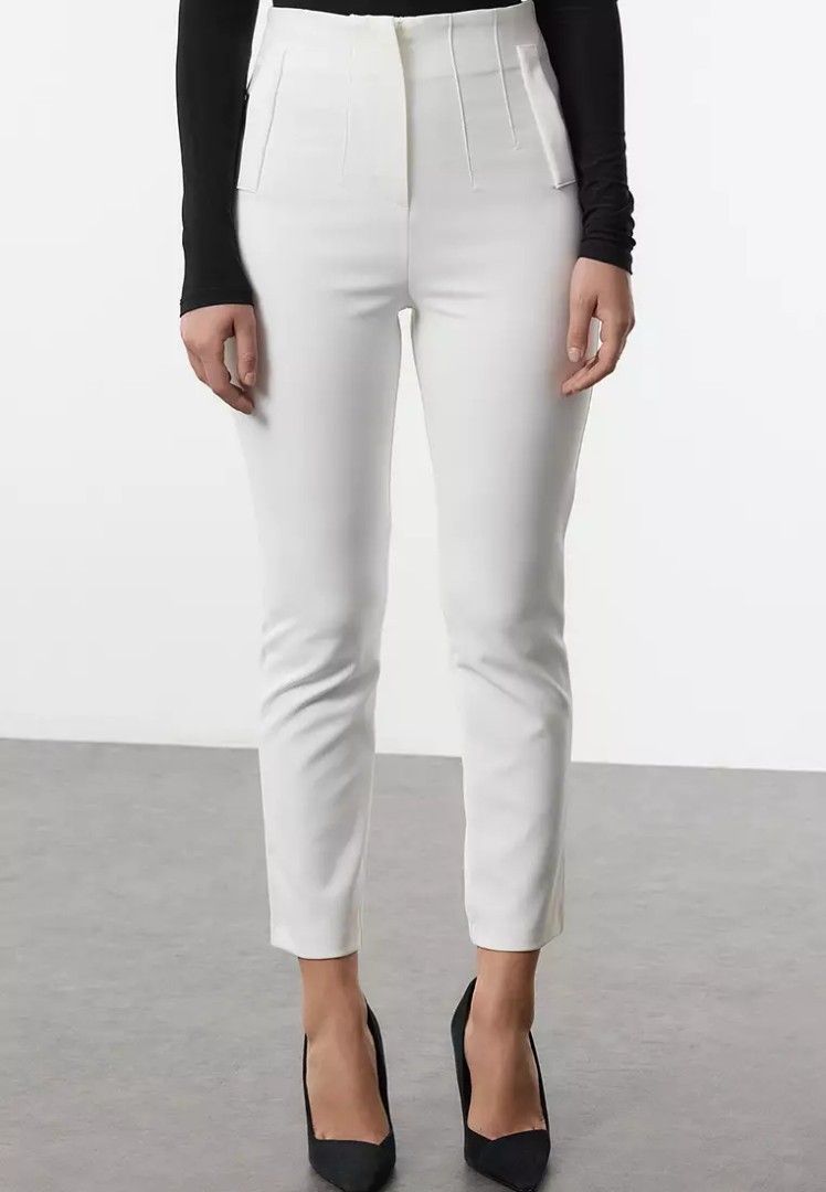 Stradivarius White High-Waisted Tailored Pants (Category: Jeans) located in Quezon City. Submitted by corrnic (Listing ID 1466062616, Image 1). Description: - Color: Crisp white - Style: High-waisted with stitched front pleats and slim, ankle-tapered fit - Details: Structured waistband and functional welt hip pockets - Versatility: Perfect for workwear or weekend outings - Measurements (approx. flat lay): Waist 13 inches, Hips 19 inches - Conditi