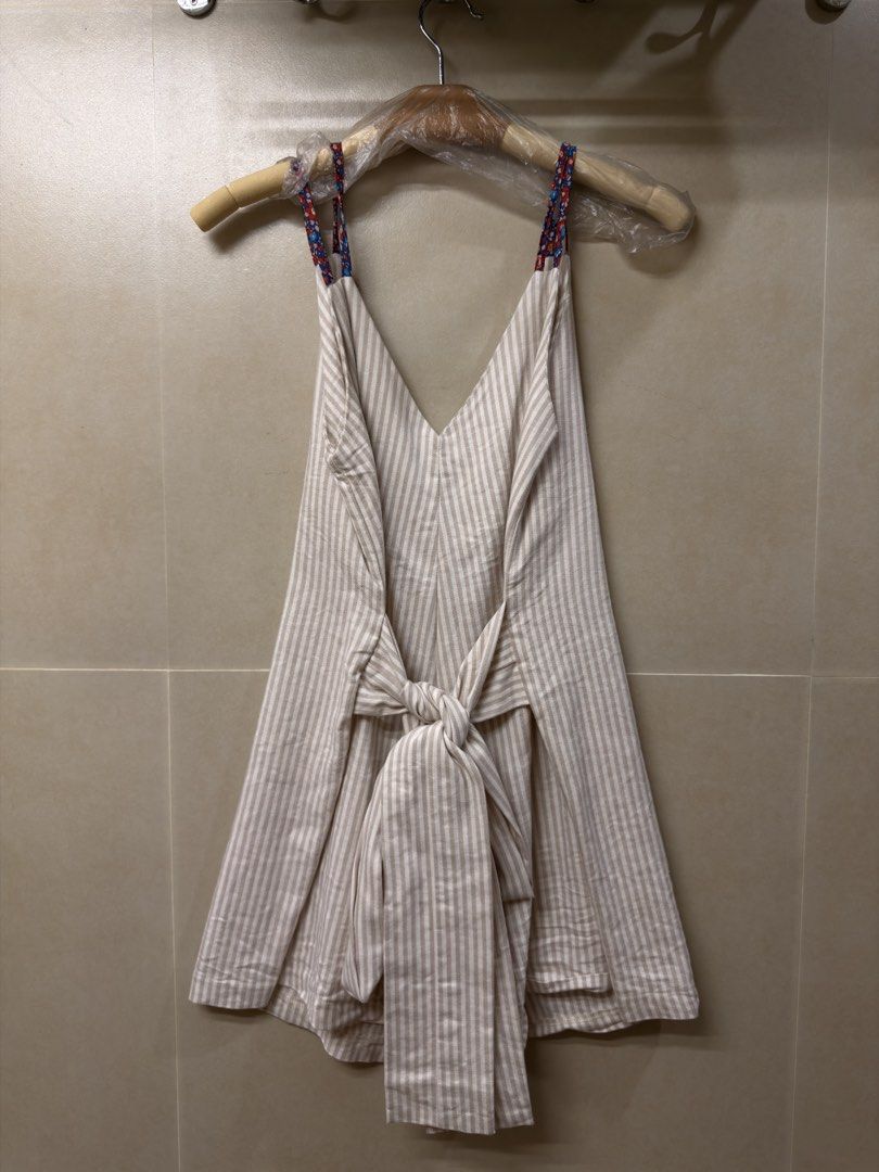 Striped Sleeveless Romper (Category: Dresses) located in Manila. Submitted by benzey (Listing ID 1465976554, Image 3). Description: Preloved and still in good condition. 🤍 Color: Beige/White stripes Style: Sleeveless romper / playsuit Fit: Relaxed and comfortable.
