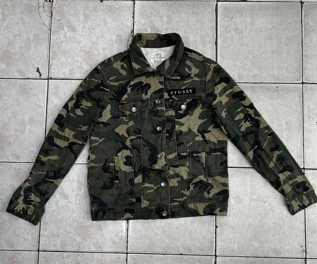 Stüssy Camouflage Leopard Back Jacket Size 10 (Category: Coats, Jackets and Outerwear) located in Cebu City. Submitted by jkeive (Listing ID 1465989709, Image 1). Description: - Brand: Stüssy - Size: 10 - 20x25 Dimension - Design: Camo denim with button-up front and collar neckline - Details: Black Stüssy text patch on right chest, buttoned cuffs - Back: Large leopard graphic printed on a dark panel - Origin: Made in China - Condition: Excellent 