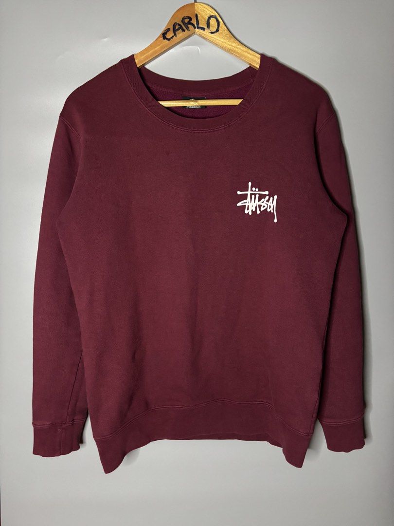 STUSSY BASIC LOGO CREWNECK (Category: Coats, Jackets and Outerwear) located in Bayambang. Submitted by lo_keythrifting (Listing ID 1465993456, Image 1). Description: - Brand: Stussy - Condition: Excellent condition - Dimes: 20*26 - Color rate: 9.8/10 - Issue: Minimal scratch see last pic - Color: Maroon - Size: Medium - Material: 100% Cotton, Made in USA - Design: Small white logo on left chest, oversized Stussy logo on back - Style: Crewneck wit