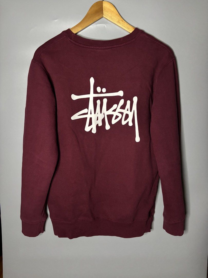 STUSSY BASIC LOGO CREWNECK (Category: Coats, Jackets and Outerwear) located in Bayambang. Submitted by lo_keythrifting (Listing ID 1465993456, Image 2). Description: - Brand: Stussy - Condition: Excellent condition - Dimes: 20*26 - Color rate: 9.8/10 - Issue: Minimal scratch see last pic - Color: Maroon - Size: Medium - Material: 100% Cotton, Made in USA - Design: Small white logo on left chest, oversized Stussy logo on back - Style: Crewneck wit