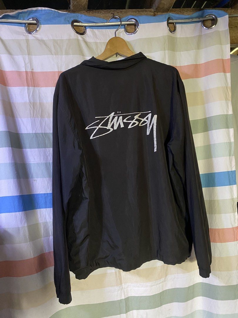 Stussy Black Coaches Jacket Size XL (Category: Coats, Jackets and Outerwear) located in Manila. Submitted by kentmarion.water (Listing ID 1465962454, Image 2). Description: - Authentic Stussy coaches jacket in clean condition - Color: Black with white Stussy logos on chest and back - Closure: Button snap with functional side pockets - Materials: 100% polyester shell, comfortable cotton body lining, and polyester sleeve lining - Fit: Standard fit,