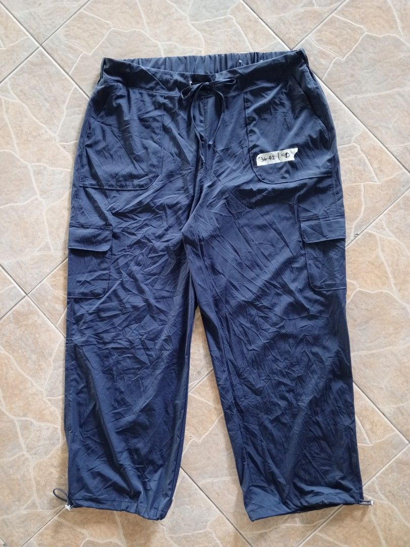 Style & Co. Blue Cargo Pants Size 1X (Category: Jeans) located in Orani. Submitted by thriftniea (Listing ID 1466043696, Image 1). Description: - Brand: Style & Co. - Size: 1X - Color: Dark Blue - Material: 86% Nylon, 14% Spandex (lightweight & stretchy) - Waistband: Elastic with drawstring closure - Features: Side utility pockets & adjustable cinched cuffs - Origin: Made in Vietnam.