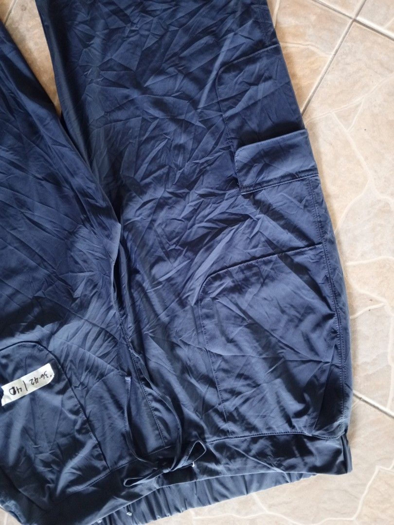 Style & Co. Blue Cargo Pants Size 1X (Category: Jeans) located in Orani. Submitted by thriftniea (Listing ID 1466043696, Image 2). Description: - Brand: Style & Co. - Size: 1X - Color: Dark Blue - Material: 86% Nylon, 14% Spandex (lightweight & stretchy) - Waistband: Elastic with drawstring closure - Features: Side utility pockets & adjustable cinched cuffs - Origin: Made in Vietnam.