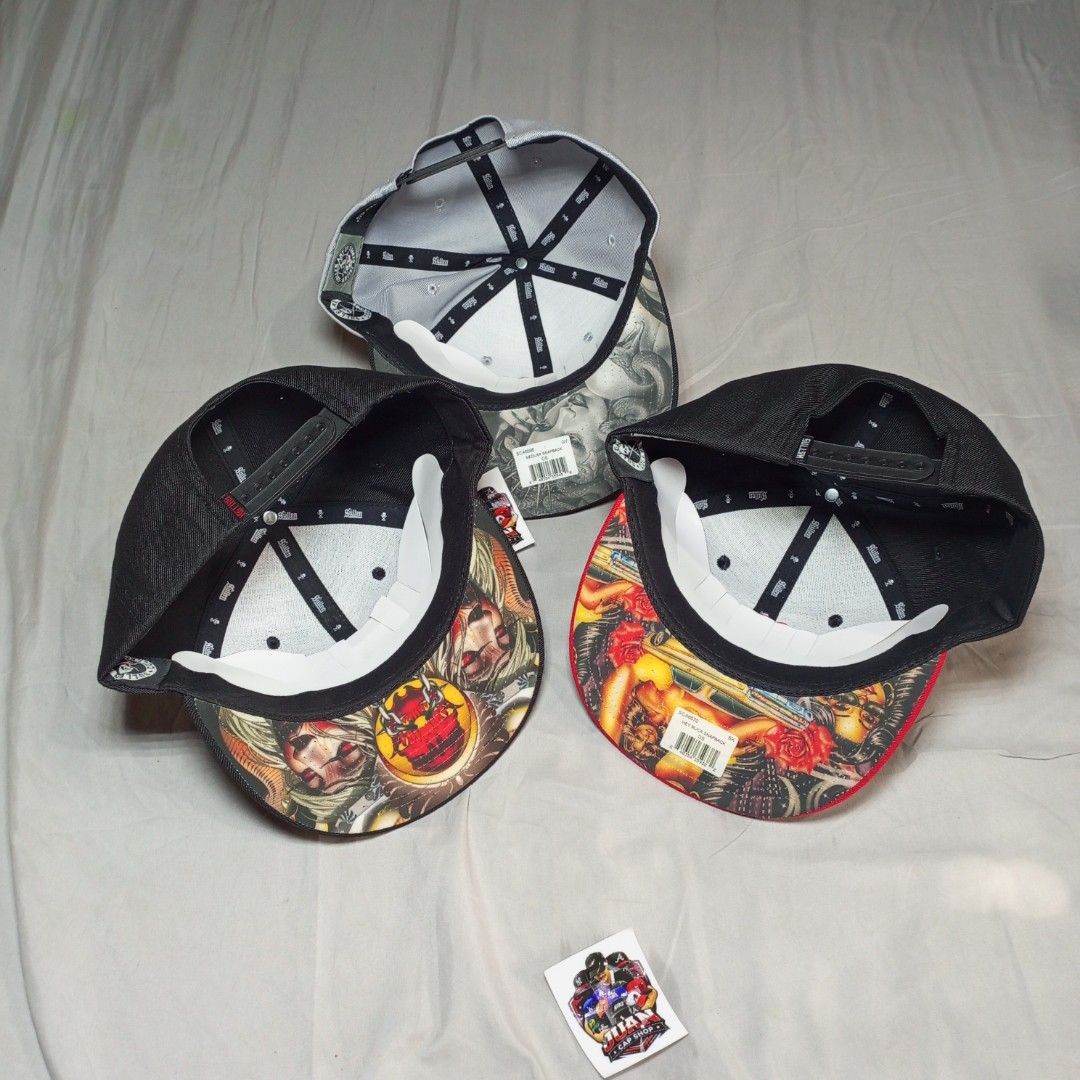 Sullen Art Collective Snapback Caps (Category: Caps & Hats) located in General Santos City (Dadiangas). Submitted by nonoks1234 (Listing ID 1465956137, Image 2). Description: Three Sullen Art Collective snapback caps available. Classic flat brim styles with detailed embroidery on the front and custom tattoo art graphics printed underneath the brims. Adjustable plastic snapback closure at the back for a custom fit. One size fits most. Clean condit