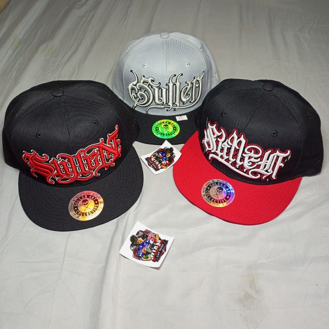 Sullen Art Collective Snapback Caps (Category: Caps & Hats) located in General Santos City (Dadiangas). Submitted by nonoks1234 (Listing ID 1465956137, Image 1). Description: Three Sullen Art Collective snapback caps available. Classic flat brim styles with detailed embroidery on the front and custom tattoo art graphics printed underneath the brims. Adjustable plastic snapback closure at the back for a custom fit. One size fits most. Clean condit