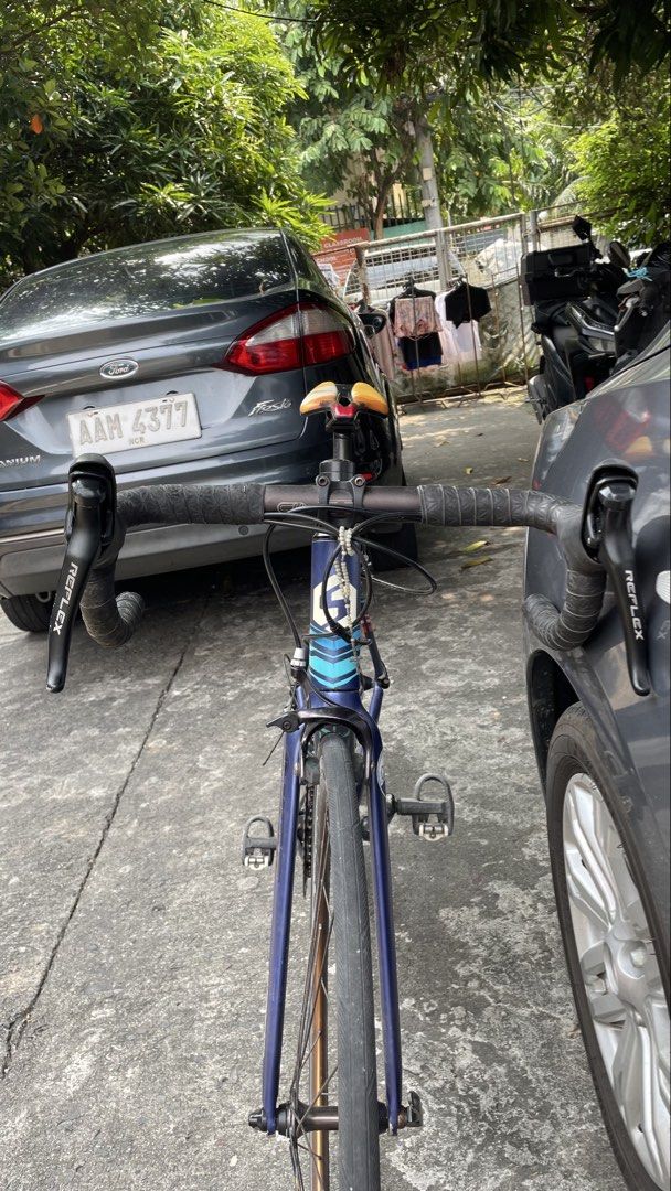 Sunpeed Triton RB plus FREEBIES (All in) (Category: Bicycles) located in Las Pinas. Submitted by caricrys59446 (Listing ID 1466022528, Image 2). Description: ALL IN FOR SALE!! STILL NEGOTIABLE Brand/Model: Sunpeed Triton Road Bike - Color: Blue - Handlebars: Drop handlebars with black tape wrapping - Drivetrain: Shimano Acera rear derailleur and Prowheel crankset - Wheels/Brakes: Quick-release wheels and dual-pivot brakes - Condition Notes: Visib
