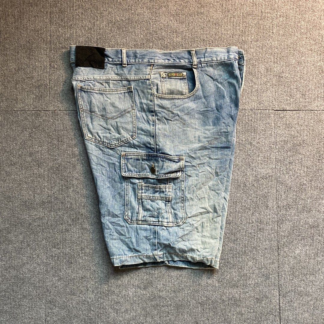 Super Star Denim Cargo Shorts Light Wash (Category: Shorts) located in Malaybalay. Submitted by mat.loots (Listing ID 1466087970, Image 2). Description: - Color/Wash: Light wash denim - Fit: Relaxed fit through the leg - Closure: Button fly - Pockets: Multiple cargo pockets with a front watch pocket - Details: Super Star metal badge on the front watch pocket and a black leather label patch on the back waistband.